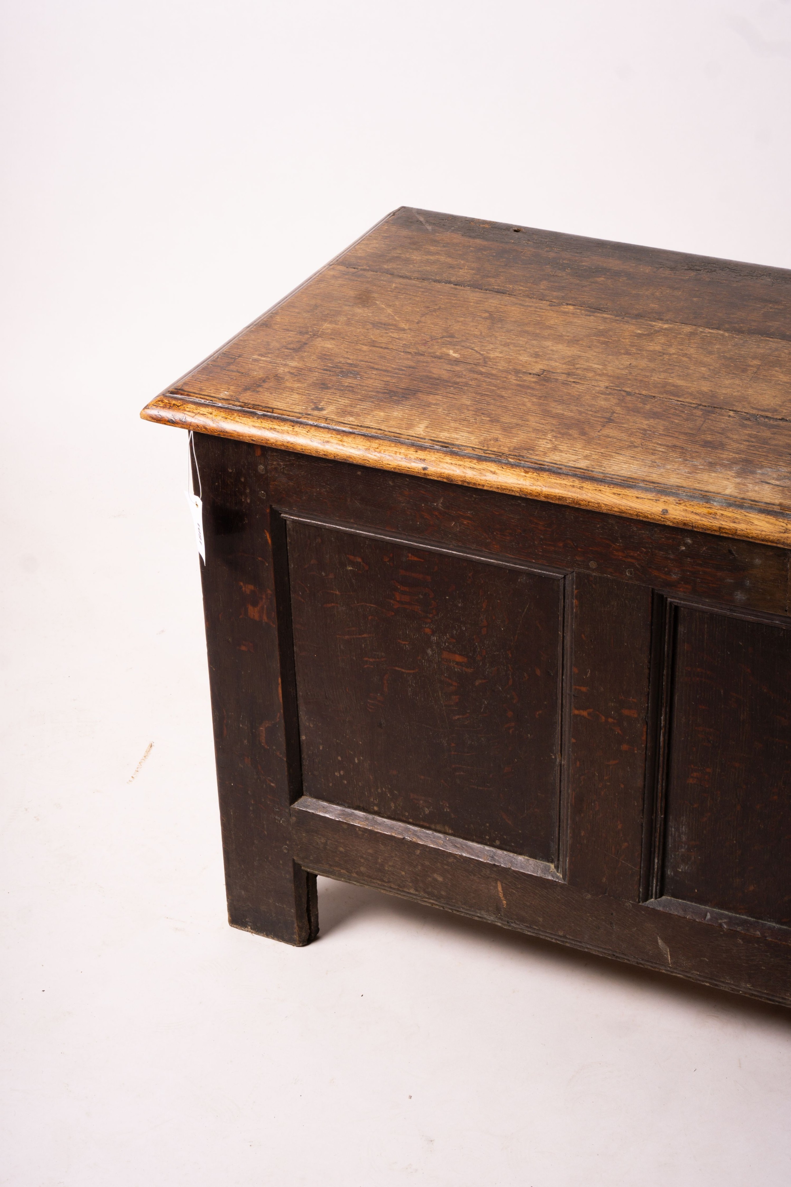 A 17th century panelled oak coffer, length 136cm, depth 56cm, height 64cm